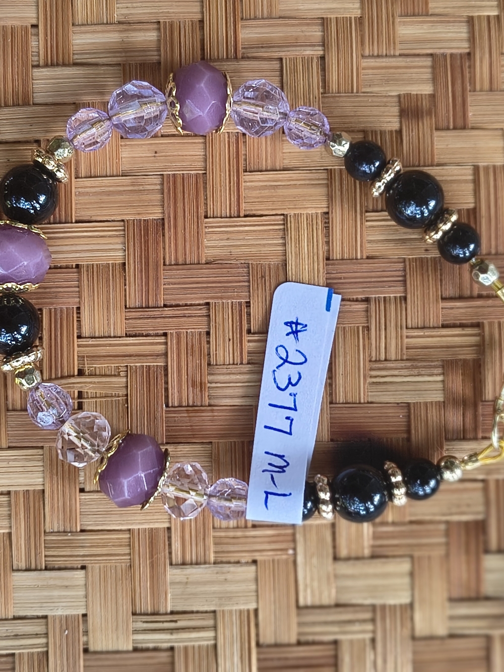 Elegant Purple and Black Beaded Bracelet with Gold Accents
